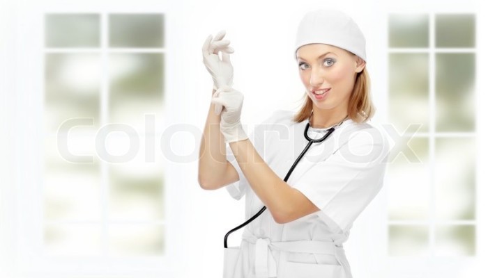 2044046-pretty-female-doctor-putting-on-the-latex-gloves-in-the-clinic-with-big-windows